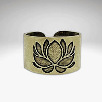 Lotus Adjustable Ring featuring an etched lotus design in antique brass finish, showcasing elegant beauty and adjustable fit.