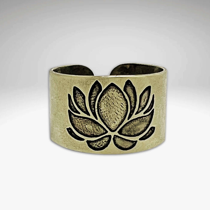 Lotus Adjustable Ring featuring an etched lotus design in antique brass finish, showcasing elegant beauty and adjustable fit.
