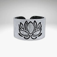 Lotus Adjustable Ring, showcasing intricate lotus design in matte silver finish, highlighting elegance and uniqueness.