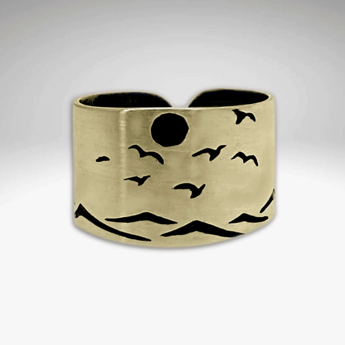 Flyover Adjustable Ring with Mountains, Waves, Full Moon and Birds in antique brass featuring nature-inspired design.