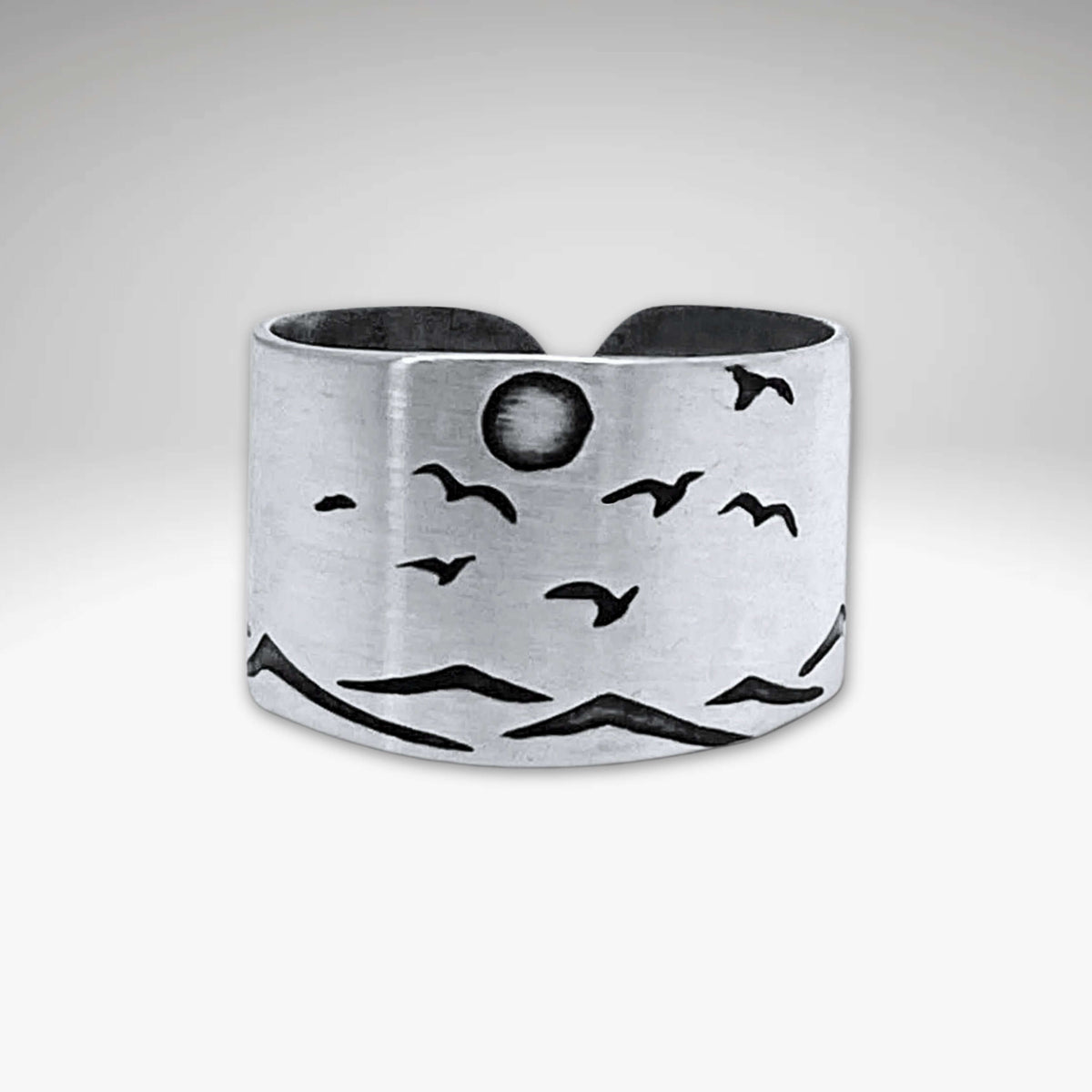 Flyover Adjustable Ring with Mountains, Waves, Full Moon and Birds displayed in matte silver design.