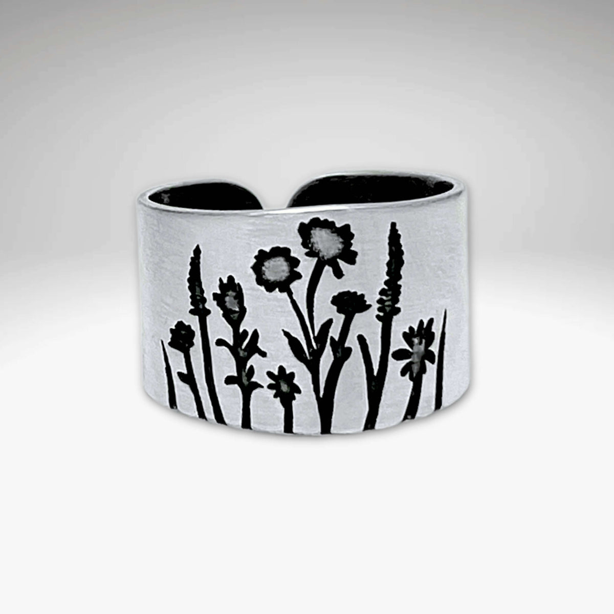 Wildflowers Adjustable Ring featuring intricate floral designs inspired by spring wildflowers.