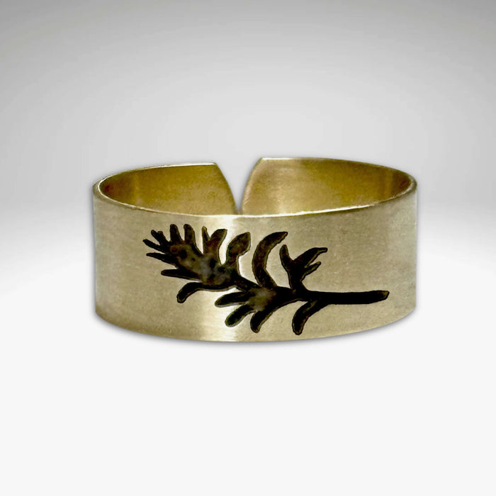 Paintbrush Adjustable Ring in Antique Brass finish showcasing a floral design inspired by Montana's wildflower.
