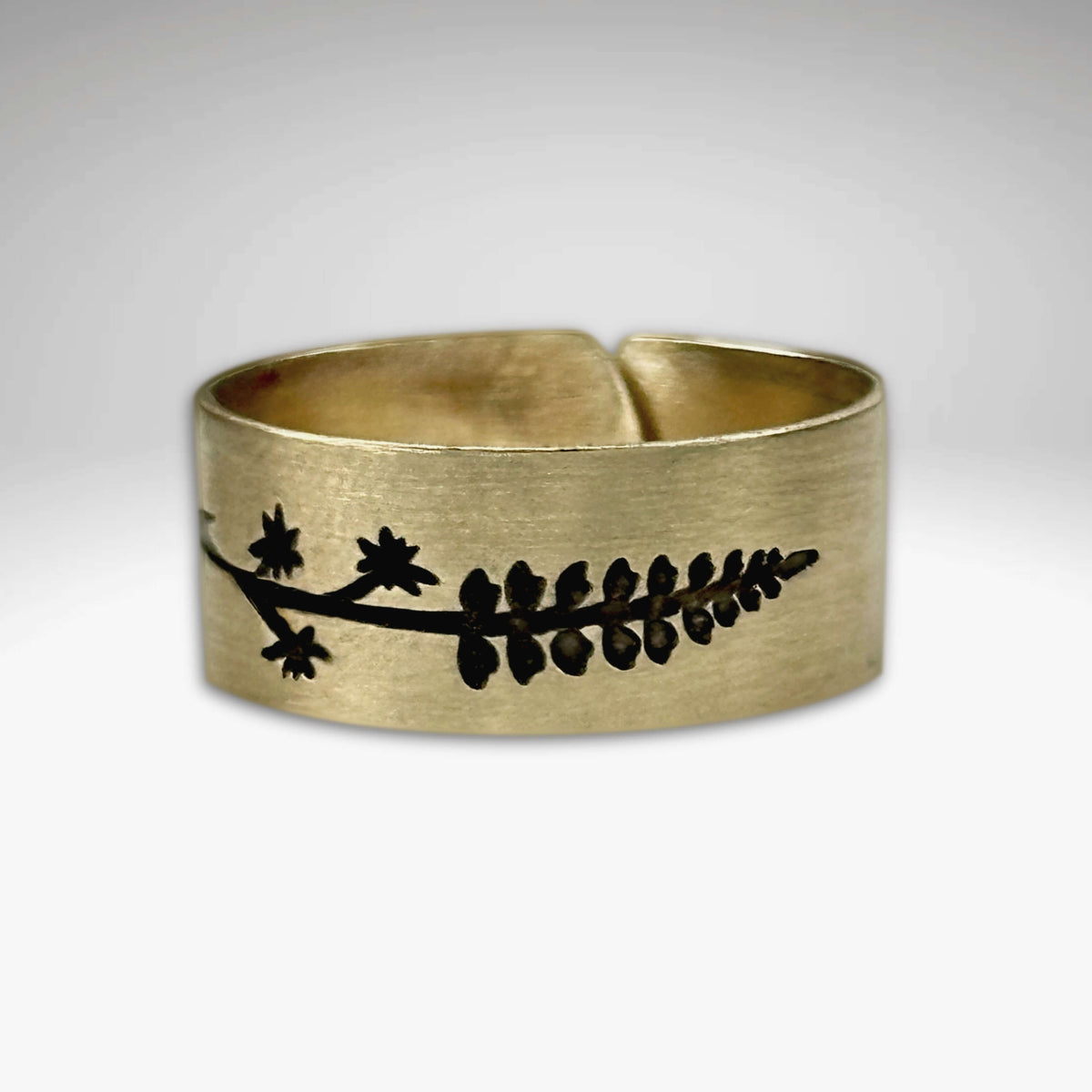 Lupine Adjustable Ring in Antique Brass featuring a wildflower design, adjustable for sizes 7 to 11.