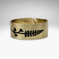 Lupine Adjustable Ring in Antique Brass featuring a wildflower design, adjustable for sizes 7 to 11.