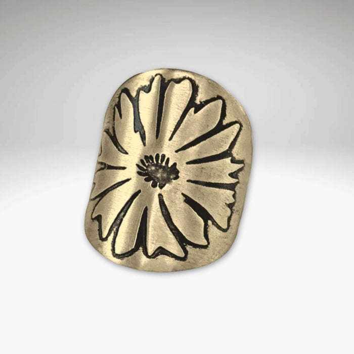 Bitterroot adjustable ring in antique brass finish featuring a hand-engraved bitterroot flower design.