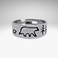 Bear Family Adjustable Ring featuring a mama bear, cub, and trees in a sleek matte silver finish.