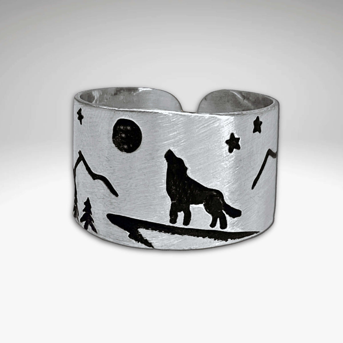 Midnight Wolf Adjustable Ring featuring a wolf silhouette, stars, and mountains in matte silver finish.