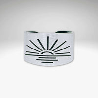 Sunrise Adjustable Ring in matte silver with sunburst design, handmade, adjustable, width 0.5 inches.