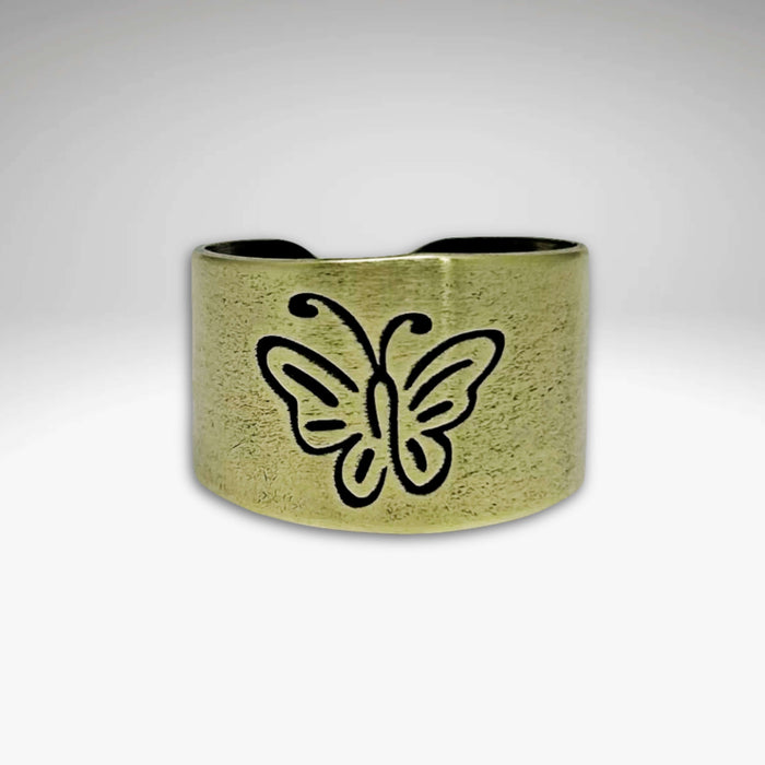 Butterfly adjustable ring in antique brass finish with a whimsical butterfly design, perfect for elegant accessorizing.