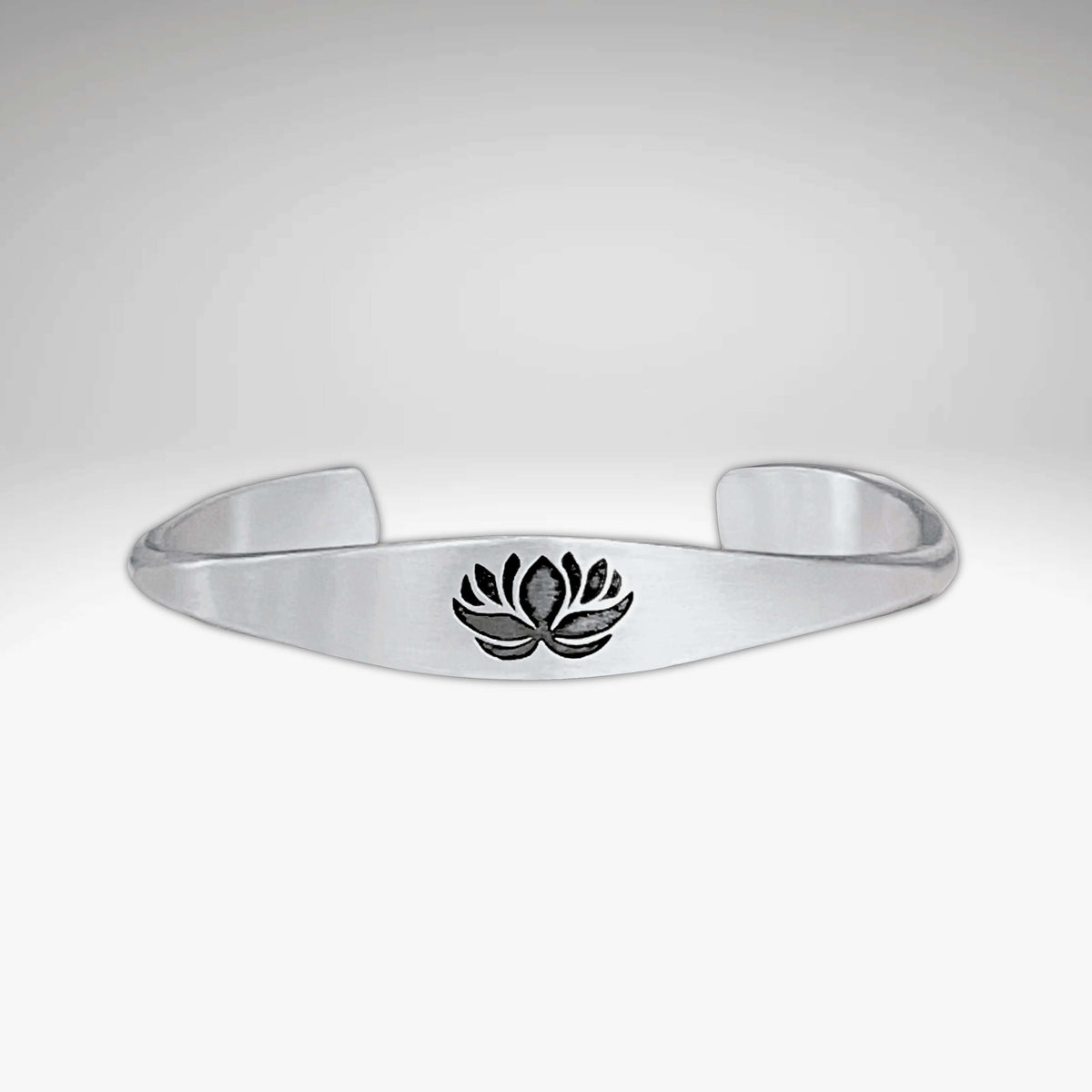 Lotus Signet Cuff Bracelet featuring a lotus motif, symbolizing resilience and inner strength.