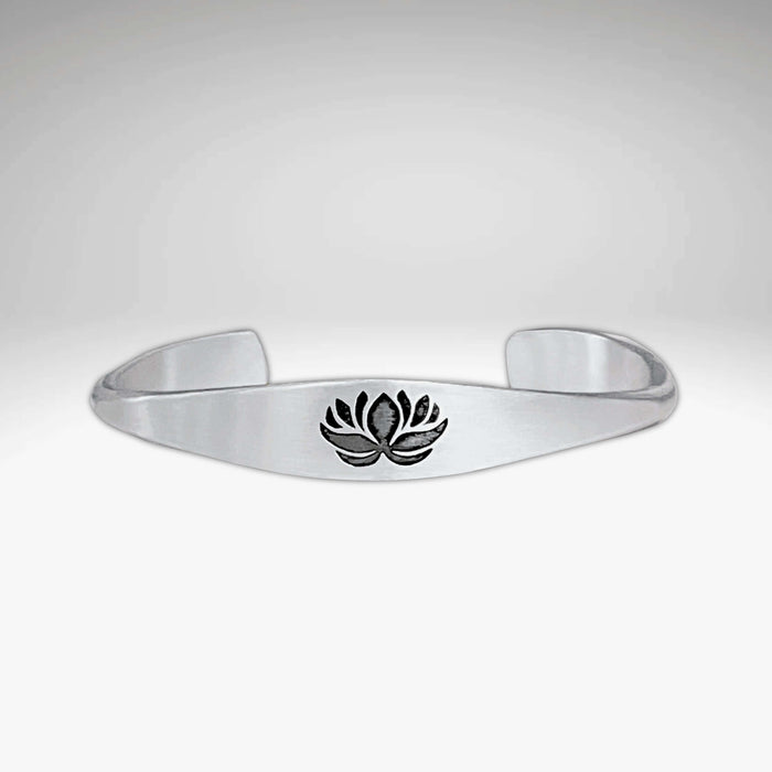 Lotus Signet Cuff Bracelet featuring a lotus motif, symbolizing resilience and inner strength.
