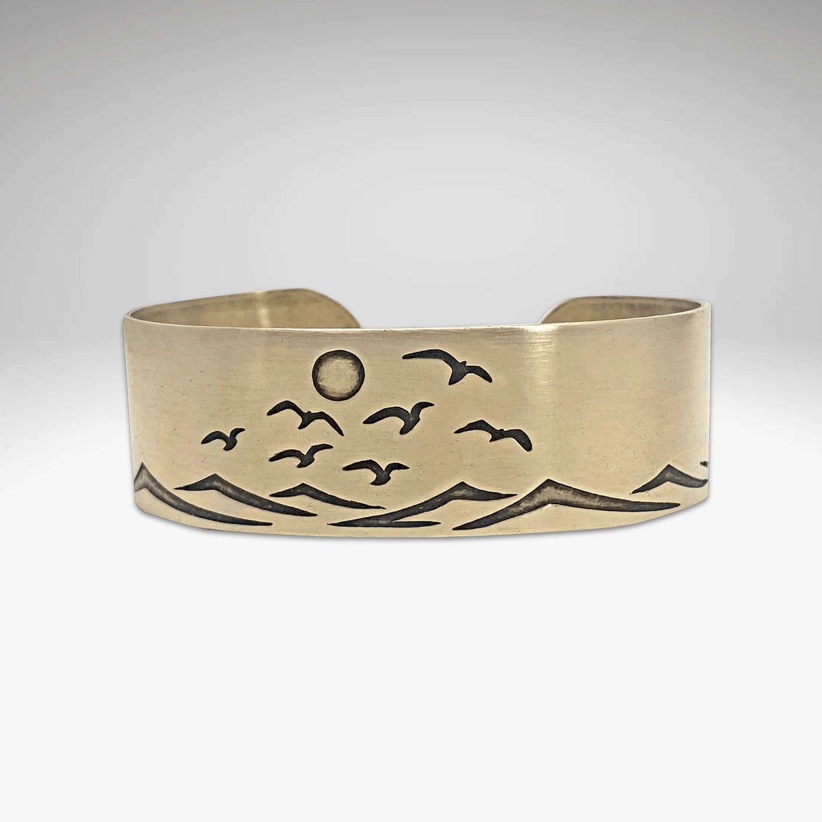 Fly Over 2 Bracelet featuring a design of waves and birds, evoking beach tranquility and sunshine.