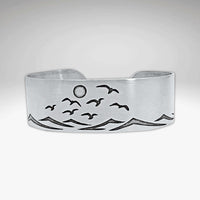 Fly Over 2 Bracelet featuring a serene beach design with waves and birds, capturing a sunny shore atmosphere.