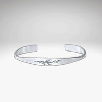 Juniper Signet Cuff Bracelet in matte silver finish featuring an etched juniper twig design.