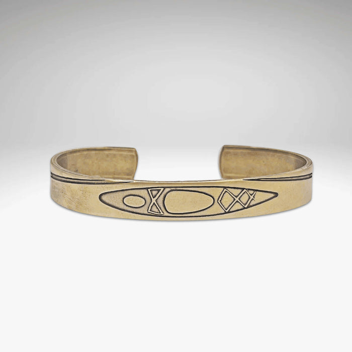 River Run Kayak Cuff Bracelet showcasing a Raw Brass design with kayak etching, adjustable for men and women.