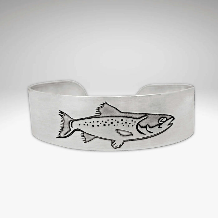 Steelhead Cuff Bracelet featuring an engraved steelhead design, perfect for fly fishing enthusiasts.