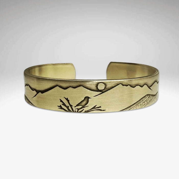 Mtn Bluebird Cuff Bracelet featuring etched mountain and bluebird design on raw brass, adjustable for comfort and style.