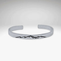 Mountainscape Mountain Cuff Bracelet in Matte Silver with laser engraved mountain design.