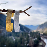 Topo Cuff Bracelet - Mountain cuff for men and women - Grand Tetons displayed in scenic mountain landscape.