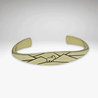 Mountain Goat cuff bracelet in antique brass with mountain design, symbolizing adventure and confidence.