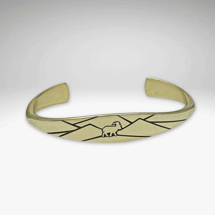 Mountain Goat cuff bracelet in antique brass with mountain design, symbolizing adventure and confidence.