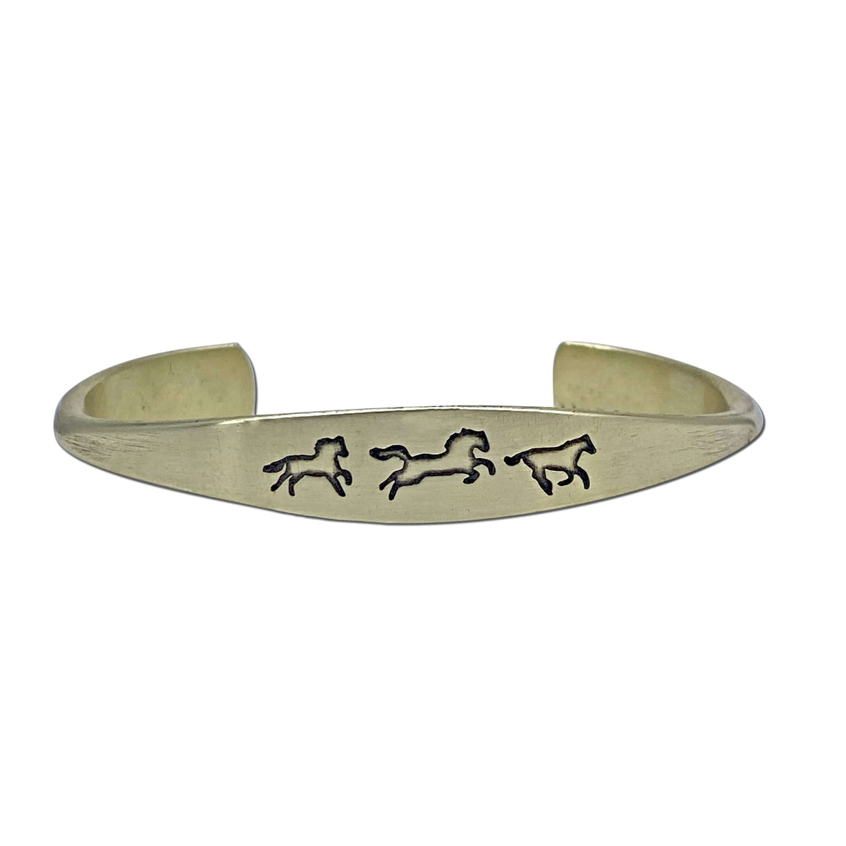 Wild Horses cuff bracelet in antique brass finish with three galloping horse designs, a timeless and elegant accessory.