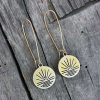 simple pair of round disc earrings with sunrise design in antique brass with gold filled earwires
