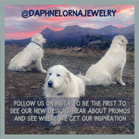 White dogs in a scenic landscape at sunset, promoting @DAPHNELORNAJEWELRY and their jewelry designs.