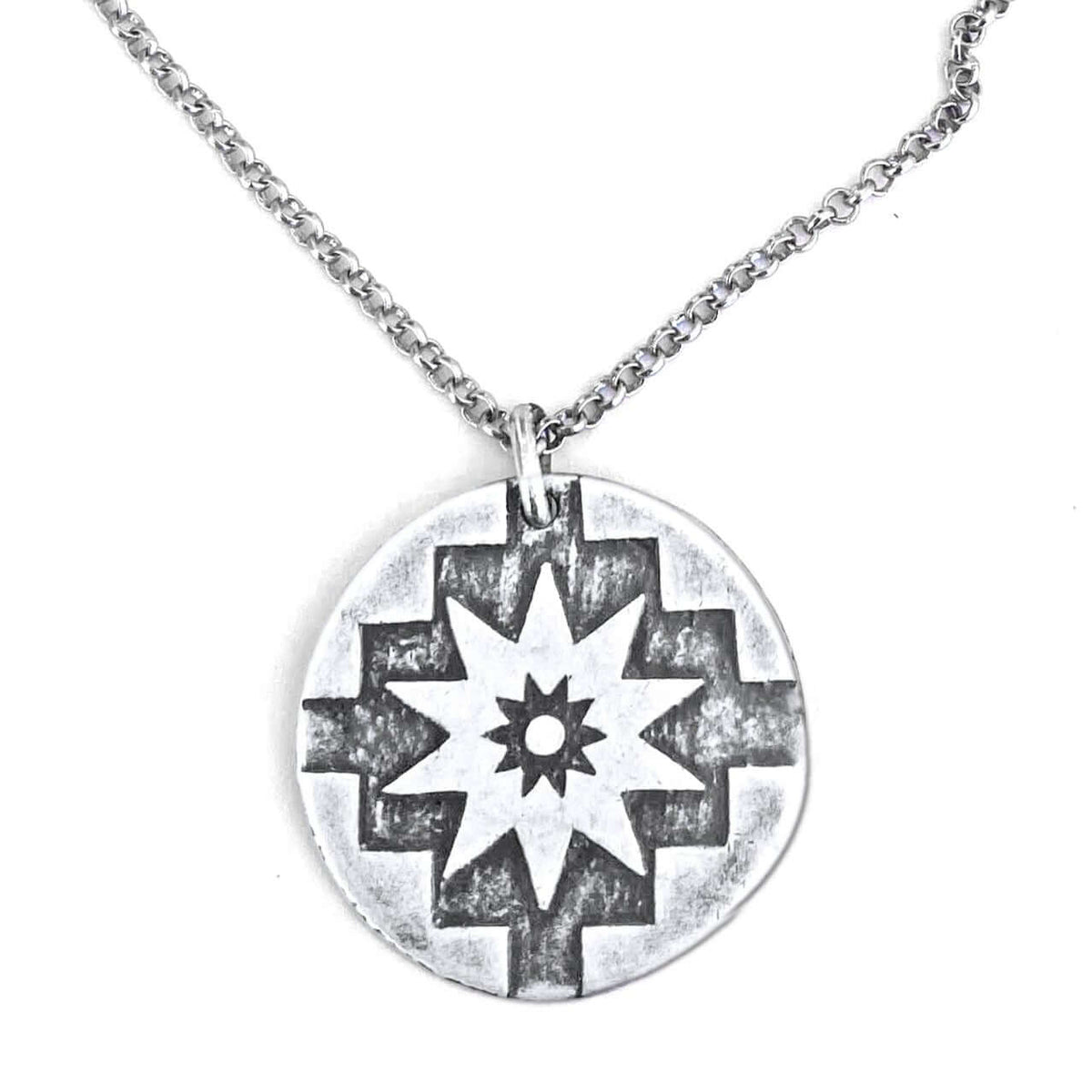 Northstar Necklace featuring a silver pendant with a star design on an adjustable chain.