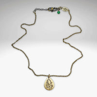 Montana Indian Paintbrush necklace featuring a teardrop pendant with a floral silhouette, adjustable from 16 inches.