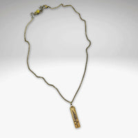 Lupine Necklace featuring a gold pendant on an adjustable rolo chain, perfect for sunny days or casual wear.