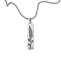 Lupine Necklace featuring a wildflower pendant on an adjustable rolo chain, perfect for sunny days.
