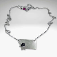 Montana outline pendant with a Bitterroot flower in Matte Silver and on a simple cable chain.