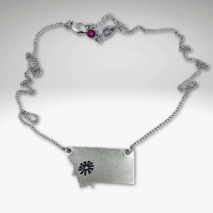 Montana outline pendant with a Bitterroot flower in Matte Silver and on a simple cable chain.