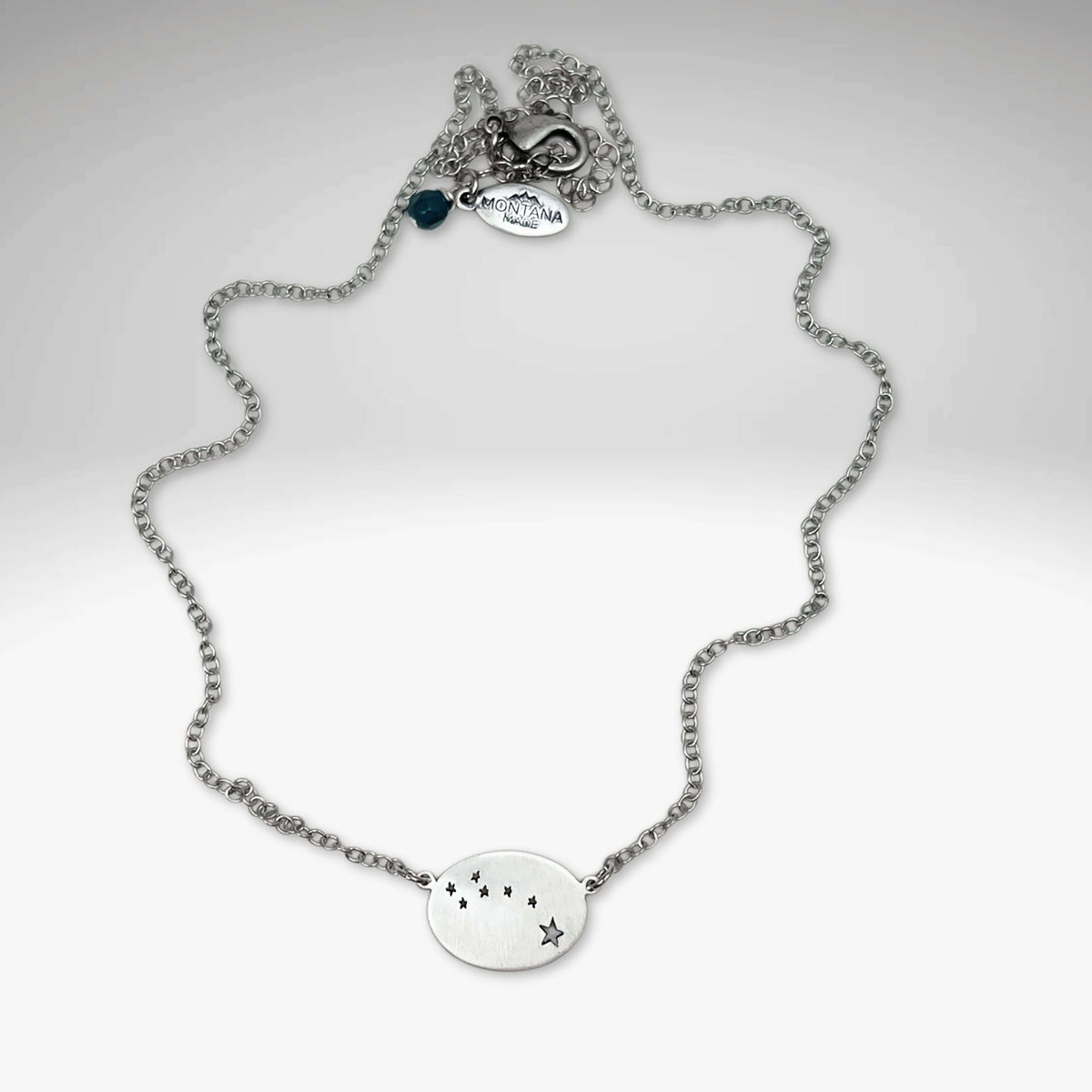 Little Dipper Necklace in Matte Silver showcasing the Ursa Minor constellation stars.