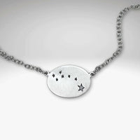 Matte Silver Little Dipper Necklace featuring seven stars from the Ursa Minor constellation on a delicate chain.