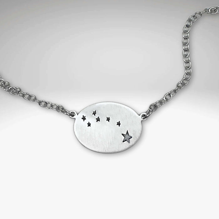 Matte Silver Little Dipper Necklace featuring seven stars from the Ursa Minor constellation on a delicate chain.