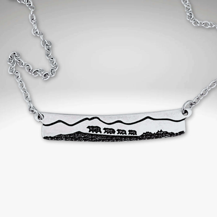 Bear Family Necklace in Matte Silver featuring a mama bear and three cubs with mountain scenery.