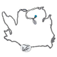 Mountain Bluebird Necklace with oval pendant, delicate bluebird design, adjustable chain from 16 to 18 inches.