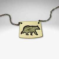 Bear Boy Necklace featuring a black bear design on an asymmetrical pendant, perfect for outdoor lovers.