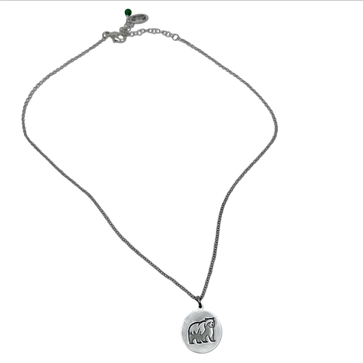 Grizzly bear pendant in matte silver featuring a grizzly bear design on a rolo chain, handmade in Montana.