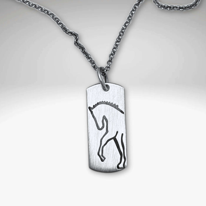 Silver pendant necklace featuring a sleek etched silhouette of a rearing horse.