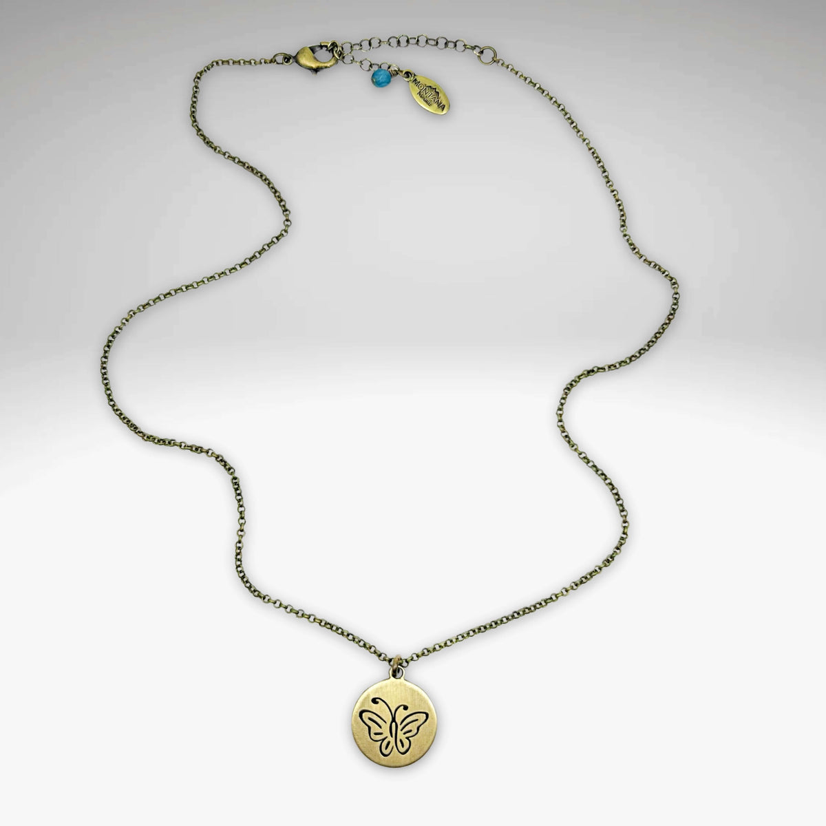 Elegant butterfly necklace with a pendant on a delicate rolo chain, showcasing nature-inspired beauty.
