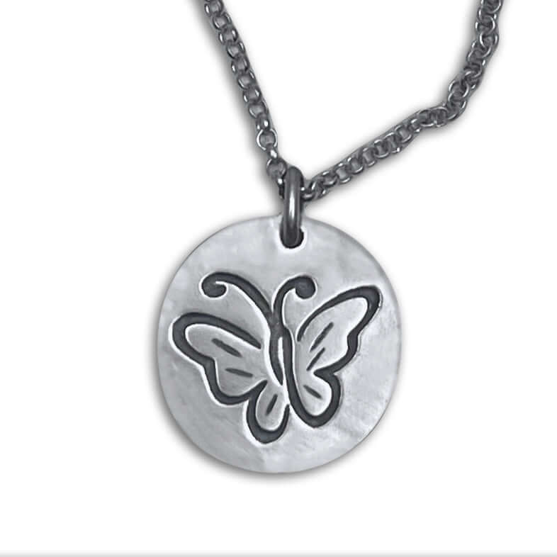 Butterfly necklace pendant featuring an etched butterfly design on a silver disc with an adjustable chain.