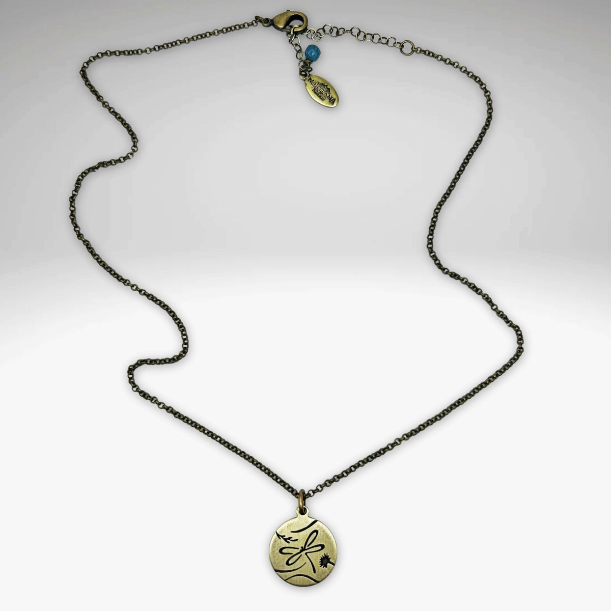 Antique brass dragonfly necklace with an adjustable chain and charm, a perfect accessory for style enhancement.
