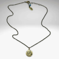 Antique brass dragonfly necklace with an adjustable chain and charm, a perfect accessory for style enhancement.