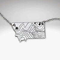 Rising Wolf MT Necklace - Topo Montana featuring a topographic design of Montana mountains.