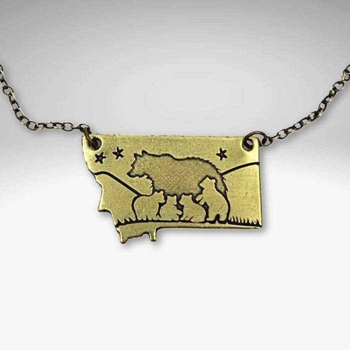 Montana outline pendant with a mama bear and four cubs in Antique Brass on a gold plated chain.