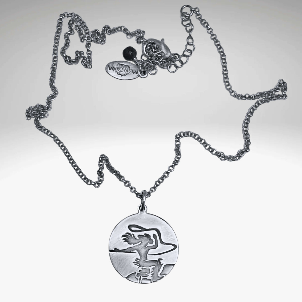 Silver pendant with a cowgirl on a horse with a lasso in matte silver on simple chain